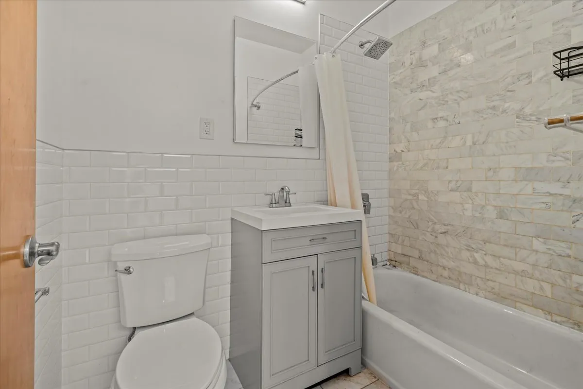 a bathroom with a sink toilet and vanity