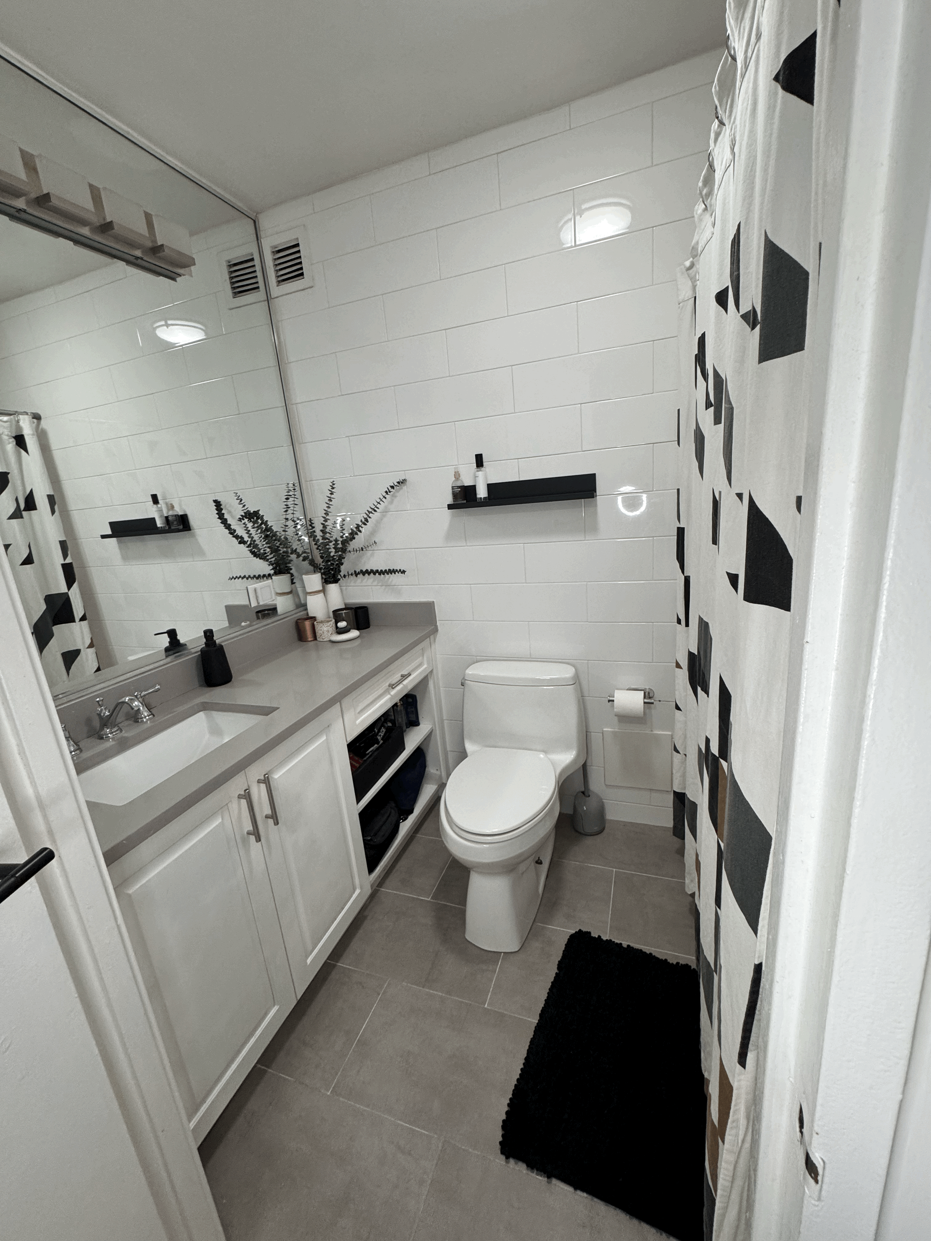 330 East 38th Street, Unit 38I Manhattan, NY 10016 - Photo 5 of 17 a spacious bathroom with a toilet a sink and a shower