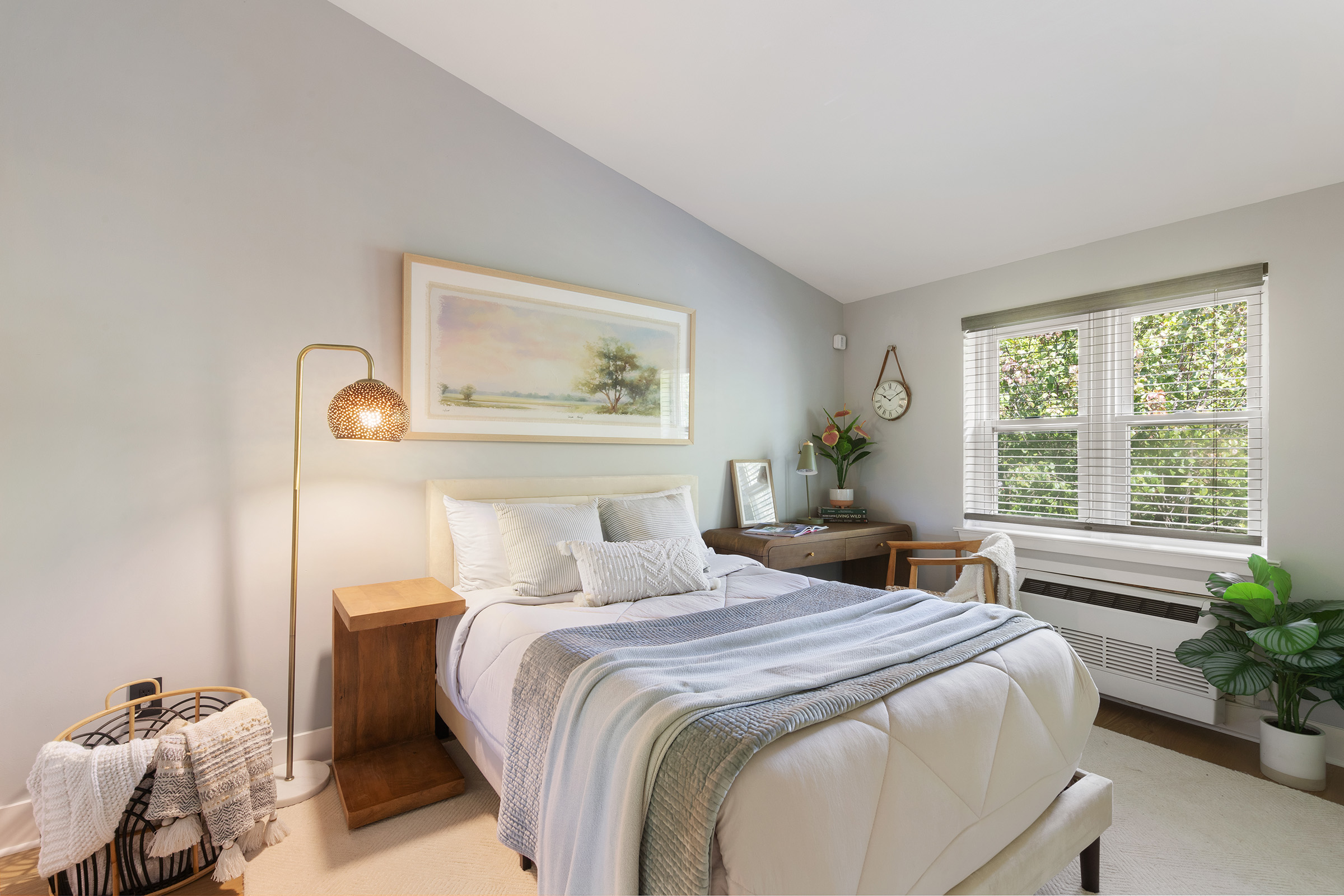 113 Prospect Park Southwest, Unit 12 Brooklyn, NY 11218 - Photo 6 of 13 a bedroom with a large bed and a potted plant