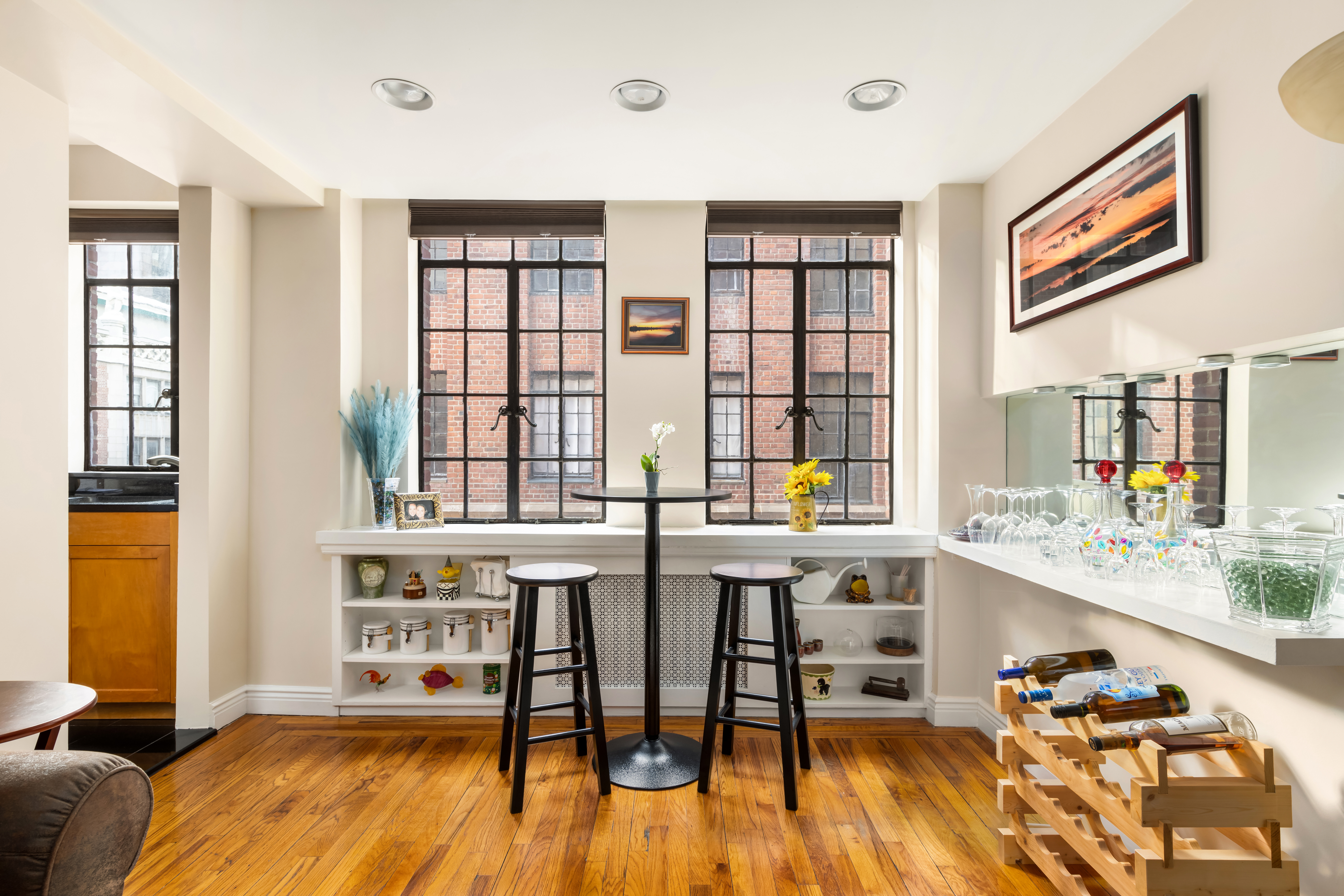 333 East 43rd Street, Unit 906 Manhattan, NY 10017 - Photo 2 of 17 a living room with furniture and large windows
