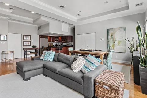 a living room with furniture and a rug