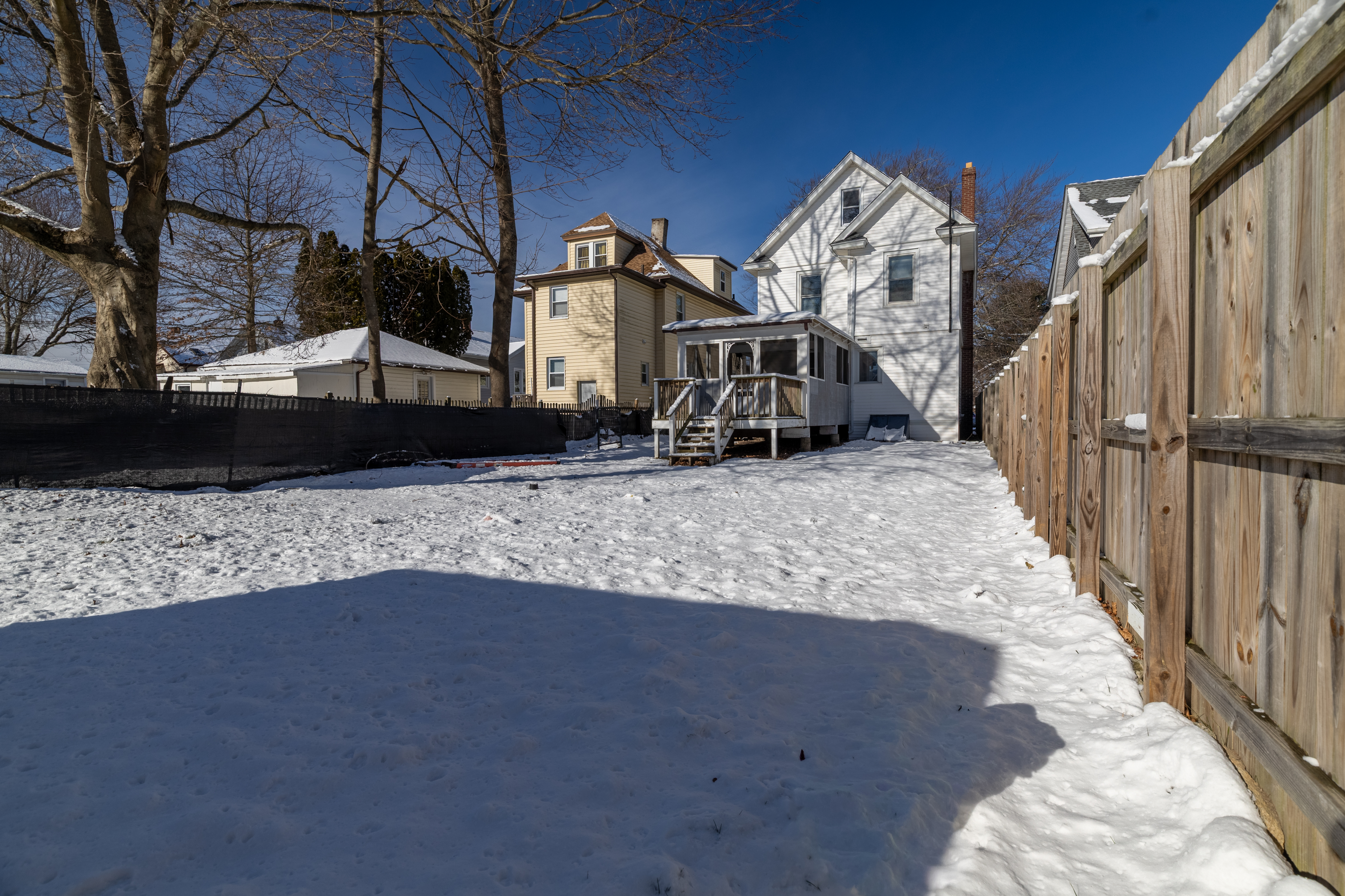 90 School Street New London, CT 06320 - Photo 28 of 34 a view of a house with a snow in the yard