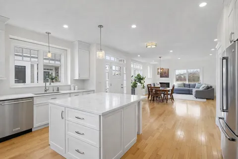 a large kitchen with lots of counter space and furniture