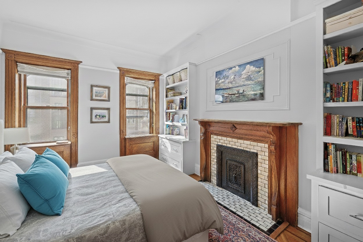 479 4th Street, Unit TRIPLEX Brooklyn, NY 11215 - Photo 13 of 17 a bedroom with a bed and a fireplace
