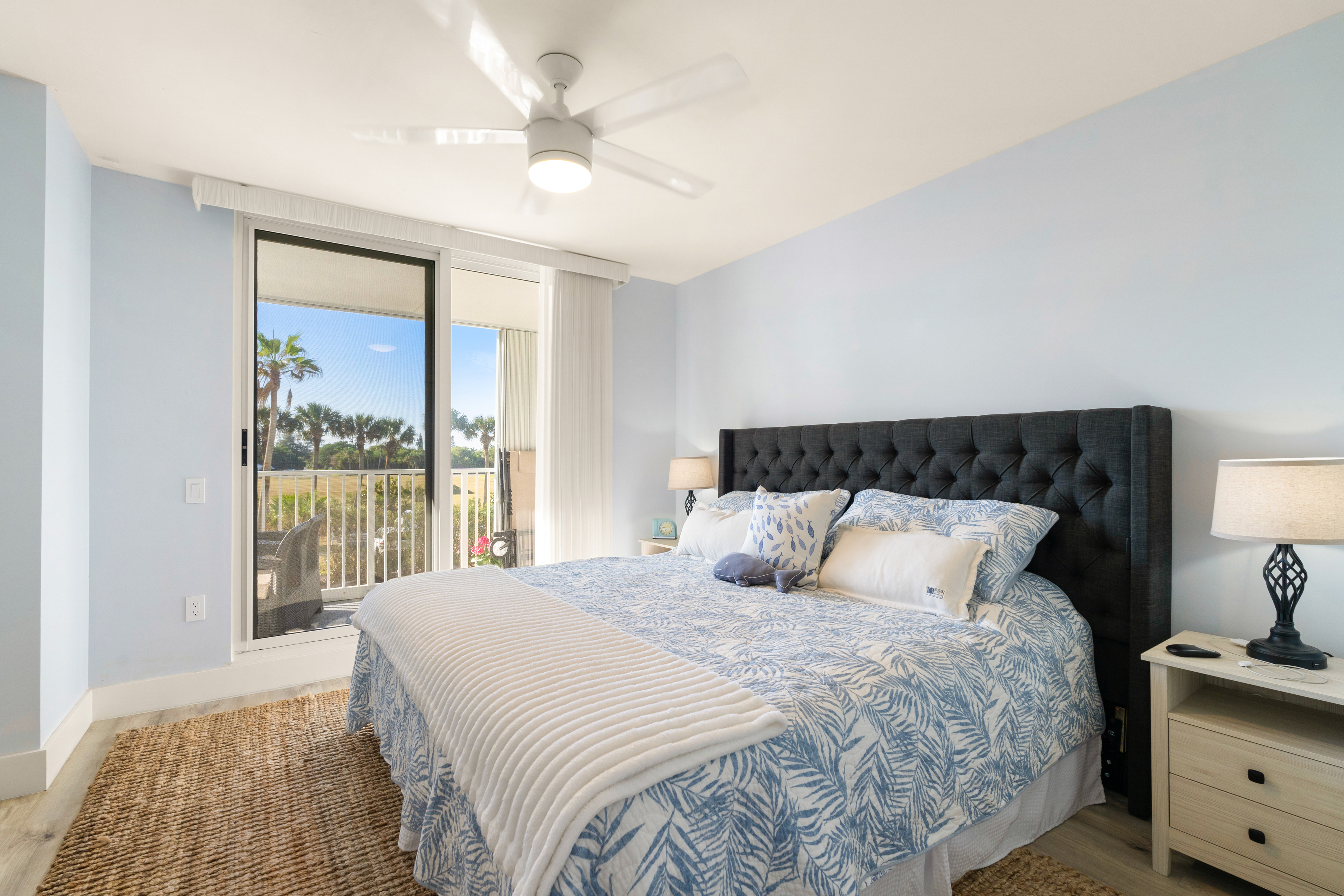 2700 North Highway A1a, Unit 207 Fort Pierce, FL 34949 - Photo 22 of 36 a bedroom with a large bed and a window