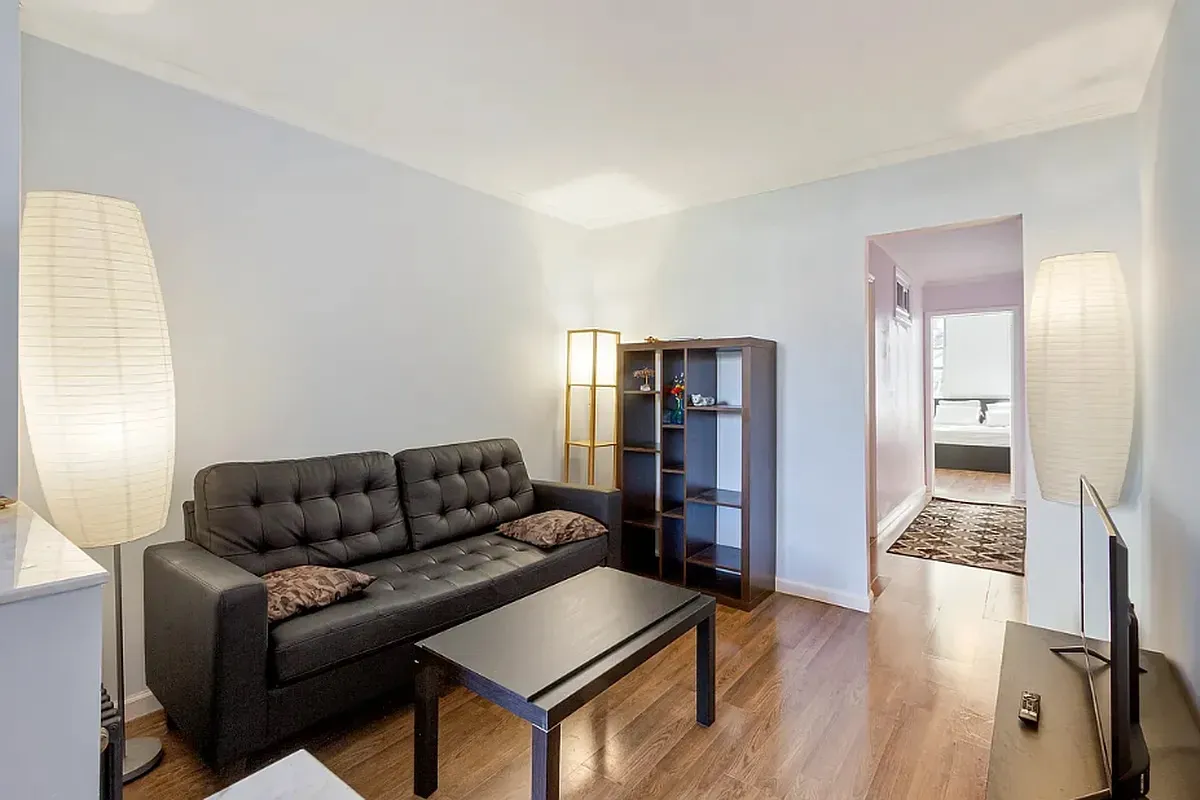 a living room with furniture or wooden floor and a window