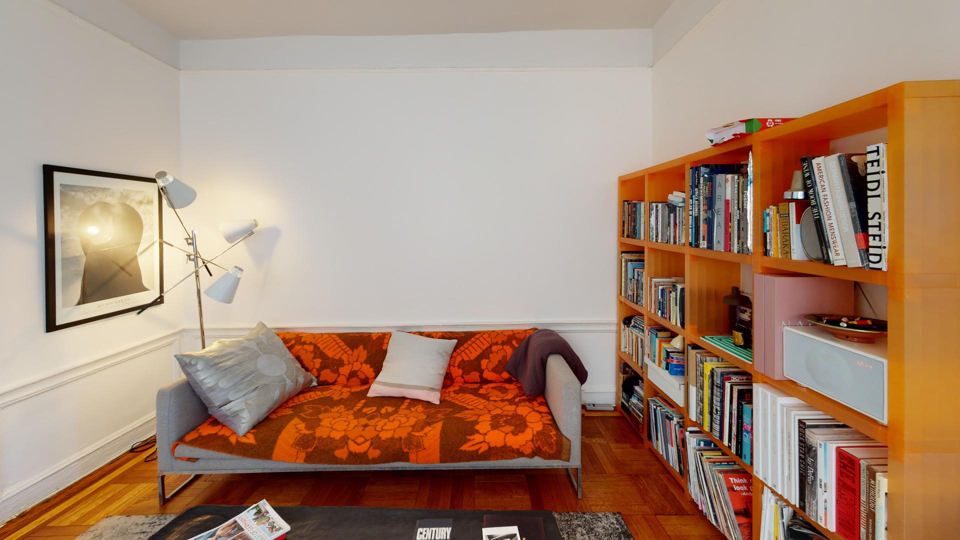 952 Saint Marks Avenue, Unit D5 Brooklyn, NY 11213 - Photo 3 of 13 a blue bench sitting in front of a building