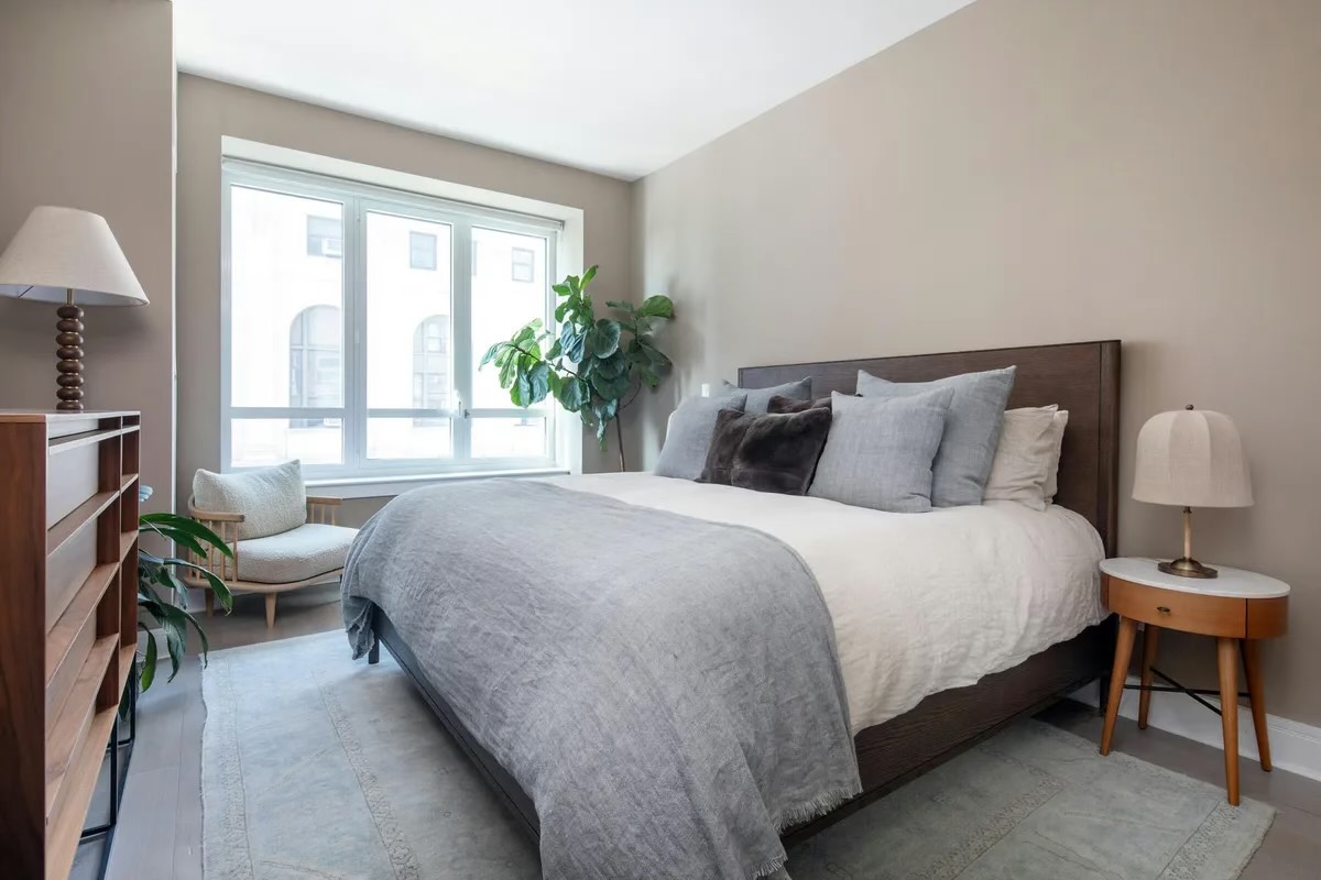 265 State Street, Unit 806 Brooklyn, NY 11201 - Photo 4 of 8 a bedroom with a bed and a large window