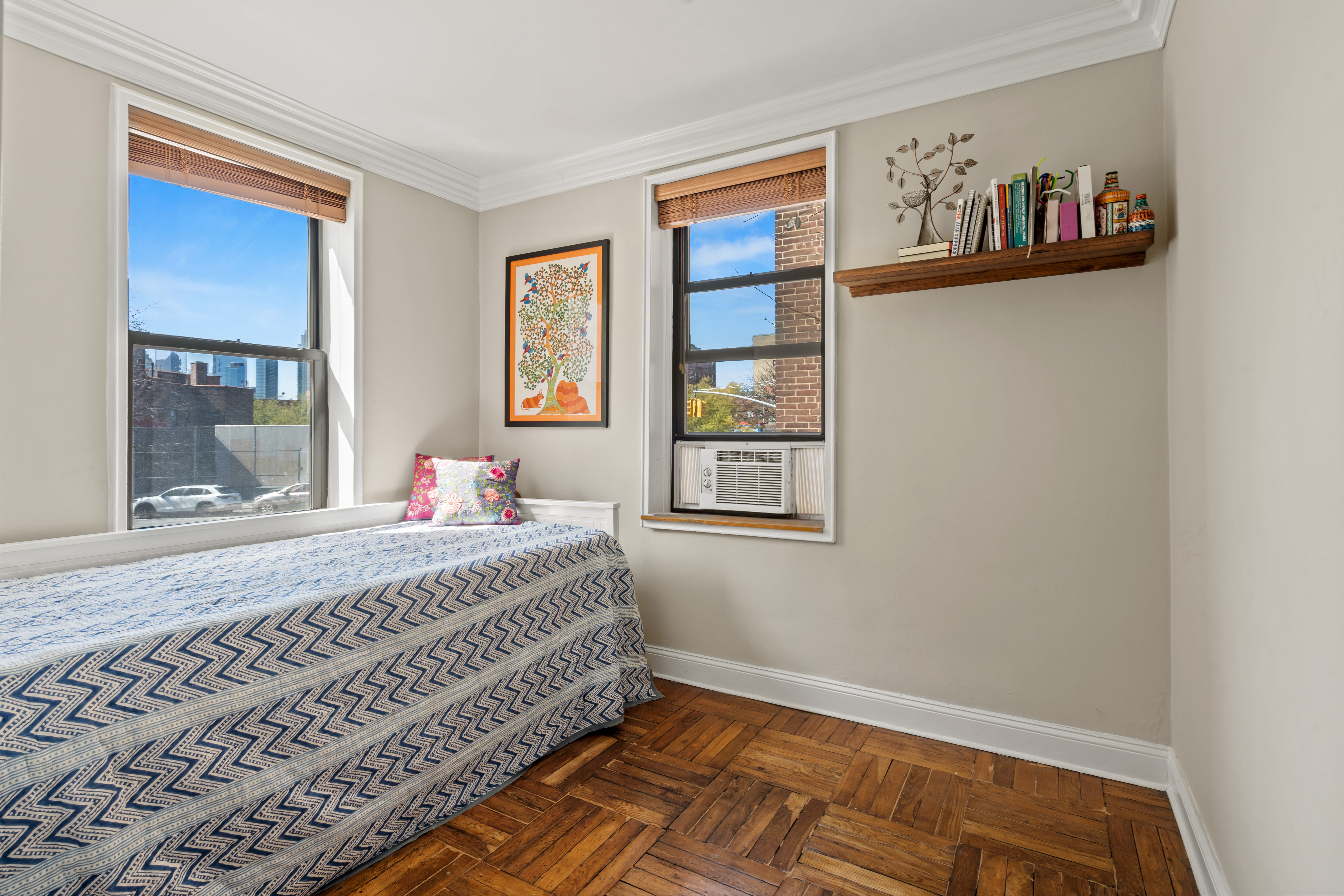 48-21 40th Street, Unit 1B Queens, NY 11104 - Photo 4 of 9 a bedroom with a bed and a window