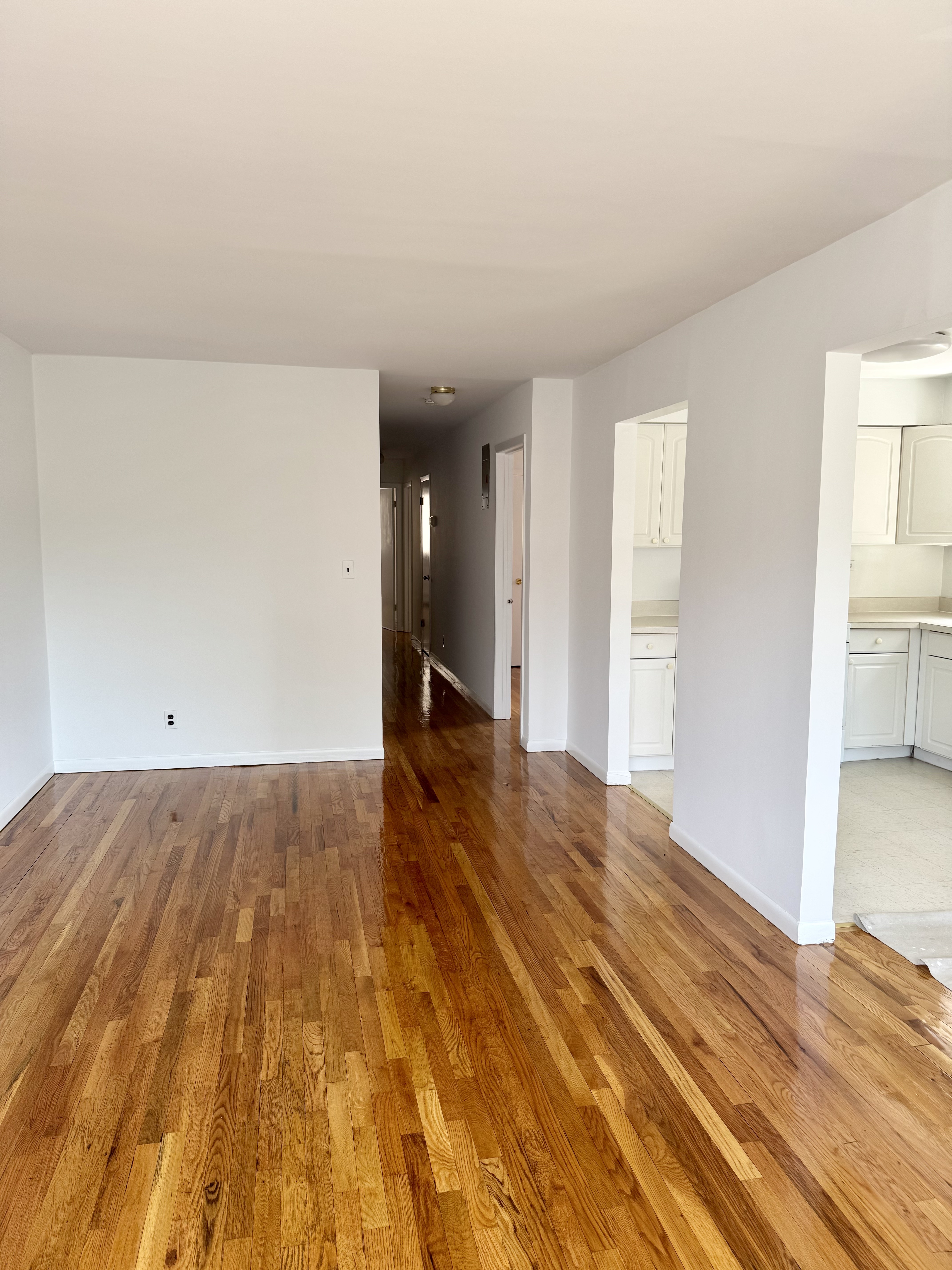 59-15 39th Avenue, Unit 2 Queens, NY 11377 - Photo 2 of 13 a view of an empty room and window