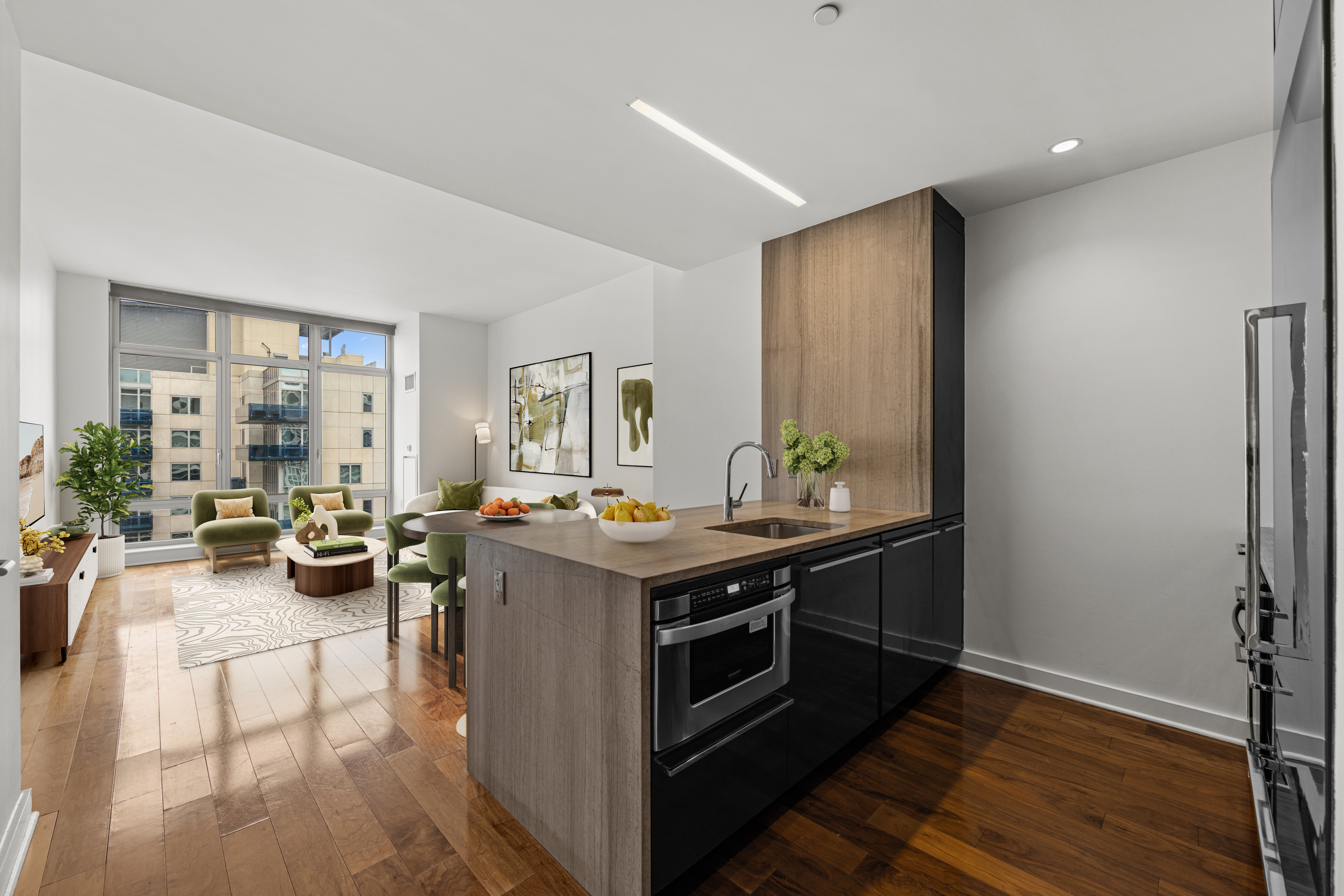 2 Northside Piers, Unit 30Y Brooklyn, NY 11249 - Photo 4 of 22 a view of a kitchen with kitchen island a stove a refrigerator and a view of living room