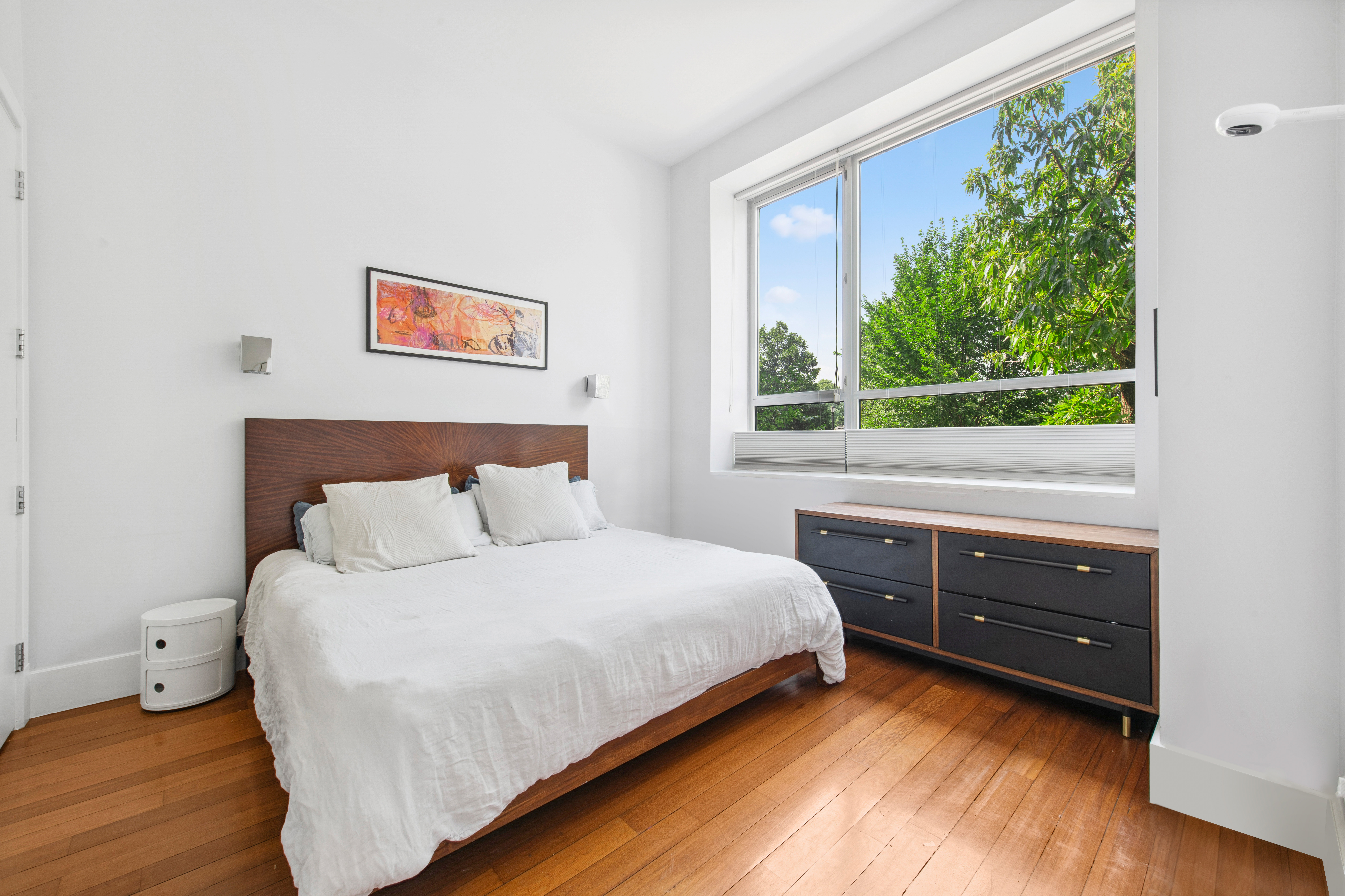 50 Bayard Street, Unit 1B Brooklyn, NY 11211 - Photo 3 of 13 a bedroom with a bed and a window