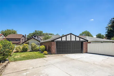 a view of a garden with a house