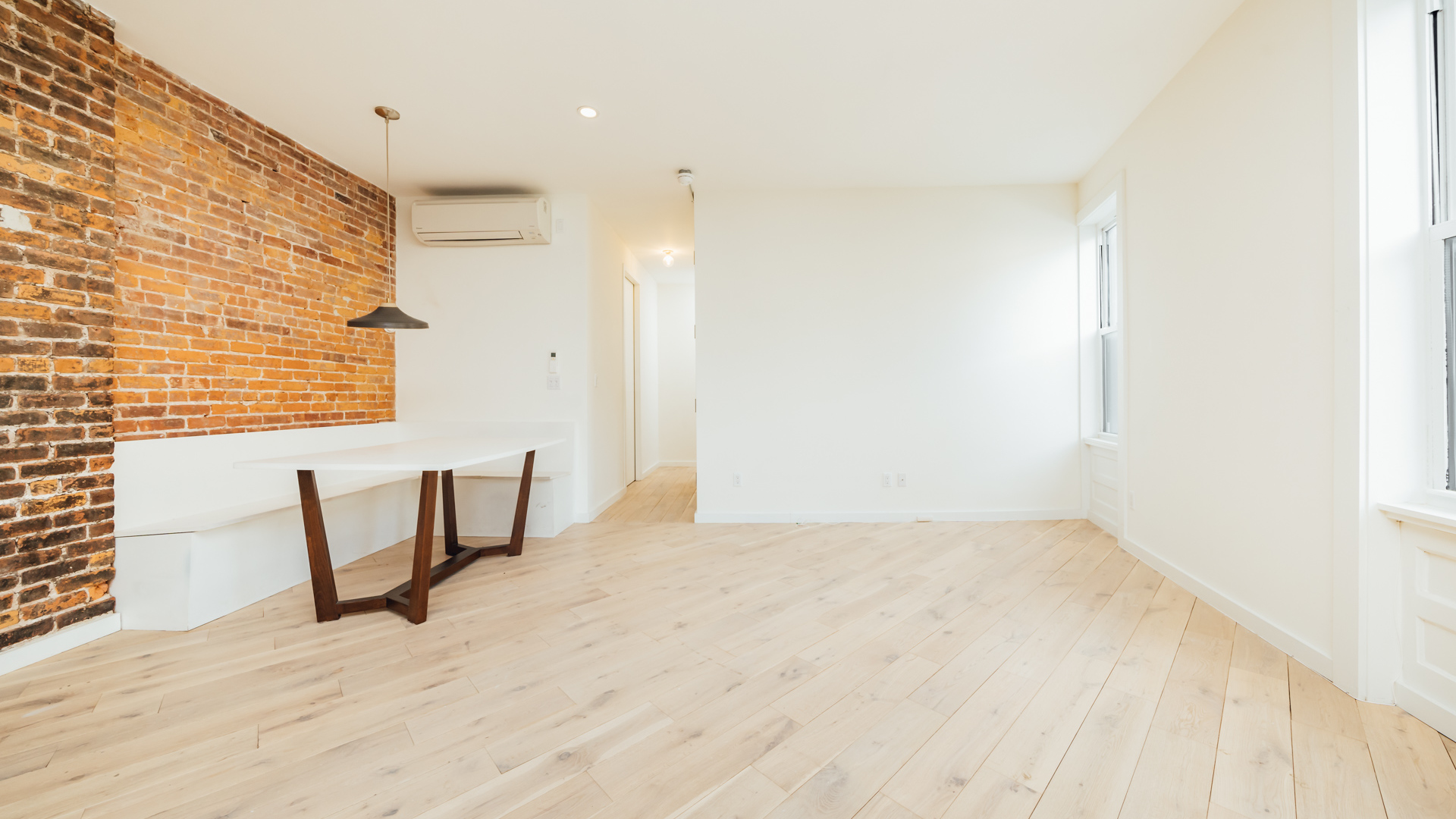 880 Woodward Avenue, Unit 2 Queens, NY 11385 - Photo 11 of 18 a view of an empty room with window