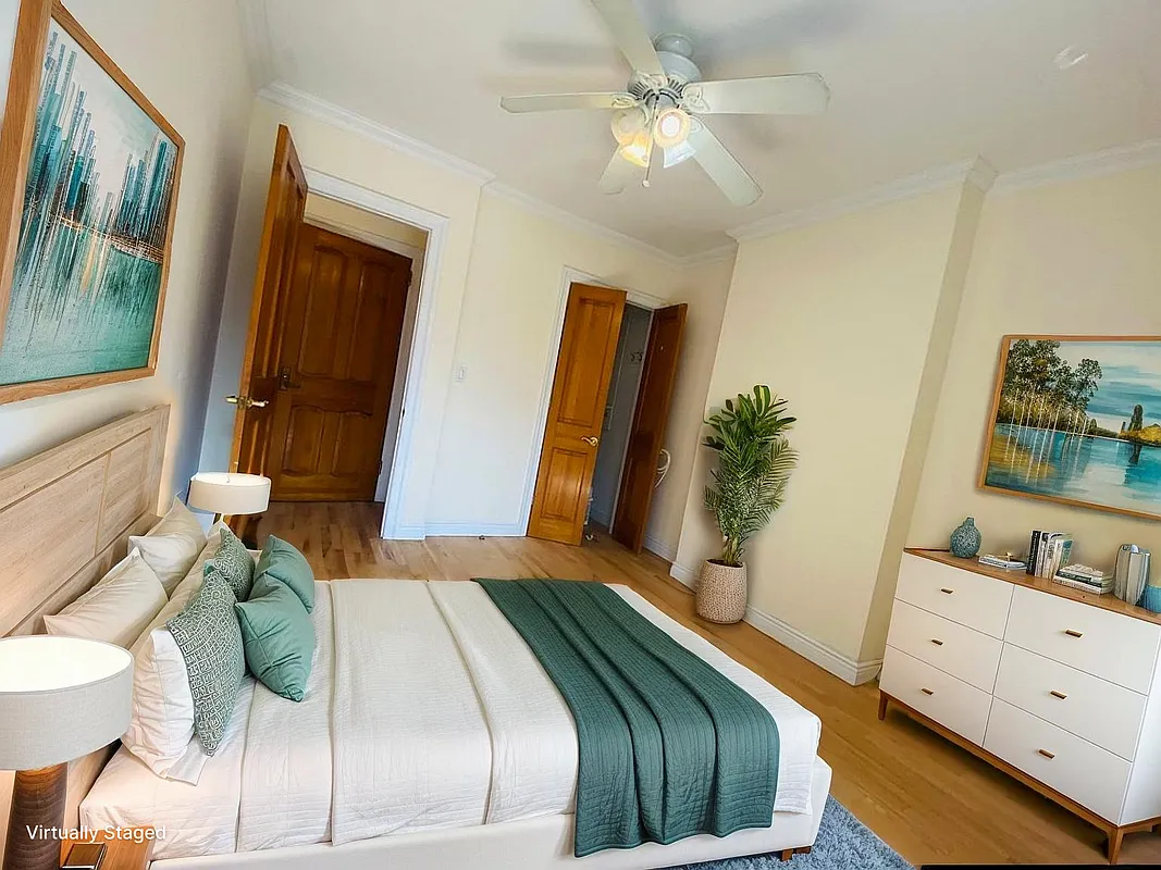 305 West 91st Street, Unit 4F Manhattan, NY 10024 - Photo 2 of 11 a bedroom with a bed mirror and on the dresser