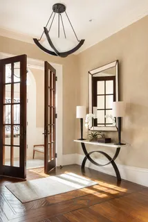 a view of a livingroom with furniture and windows