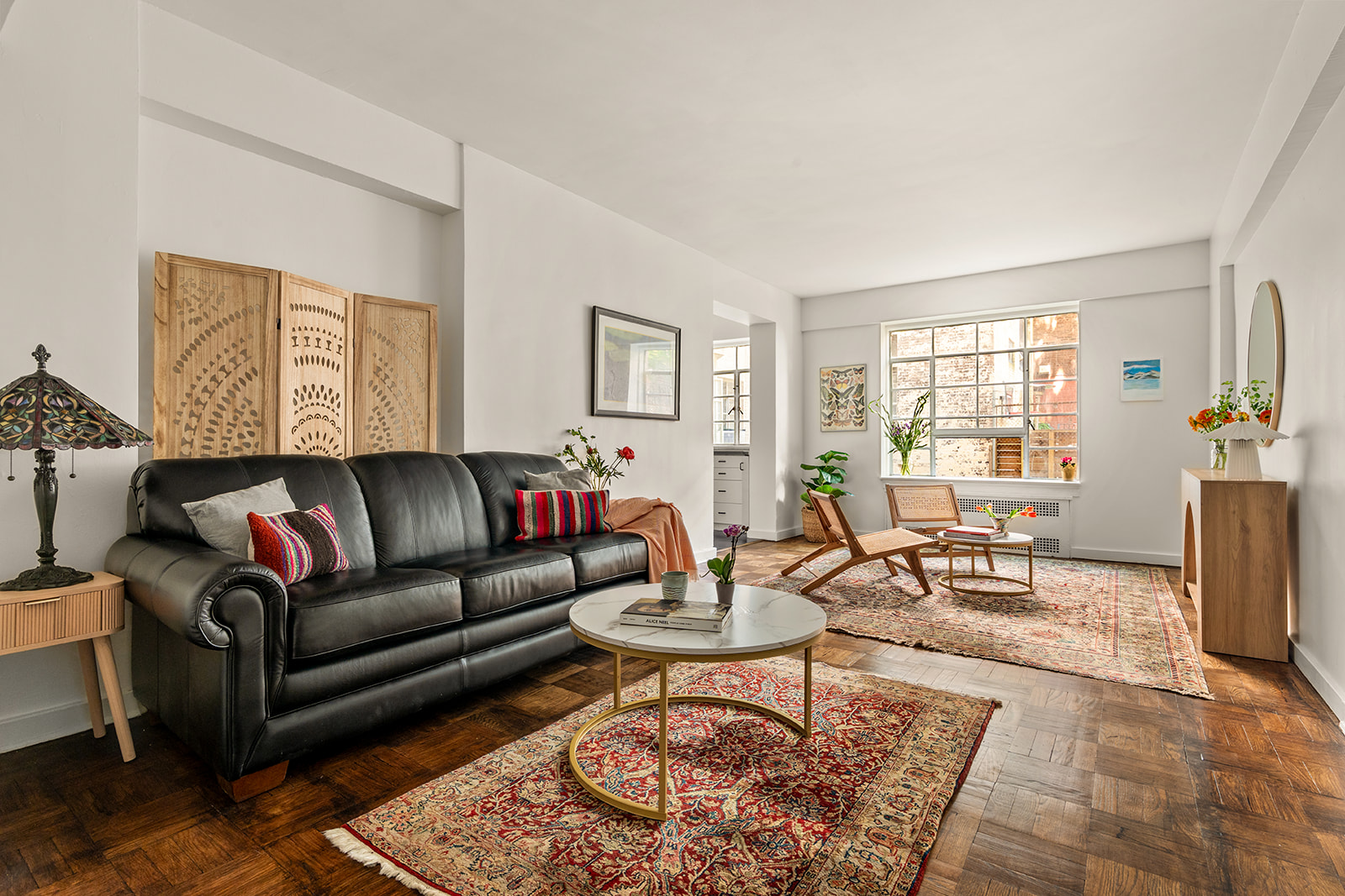 57 Montague Street, Unit 2G Brooklyn, NY 11201 - Photo 1 of 8 a living room with furniture a rug a window and a table