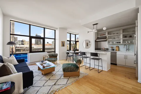 a living room with furniture and a table