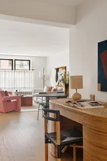 a workspace with furniture and window