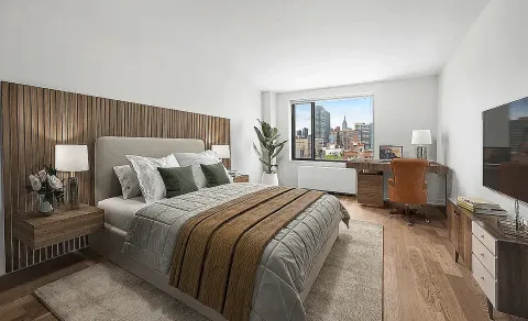 a bed room with a bed and a television