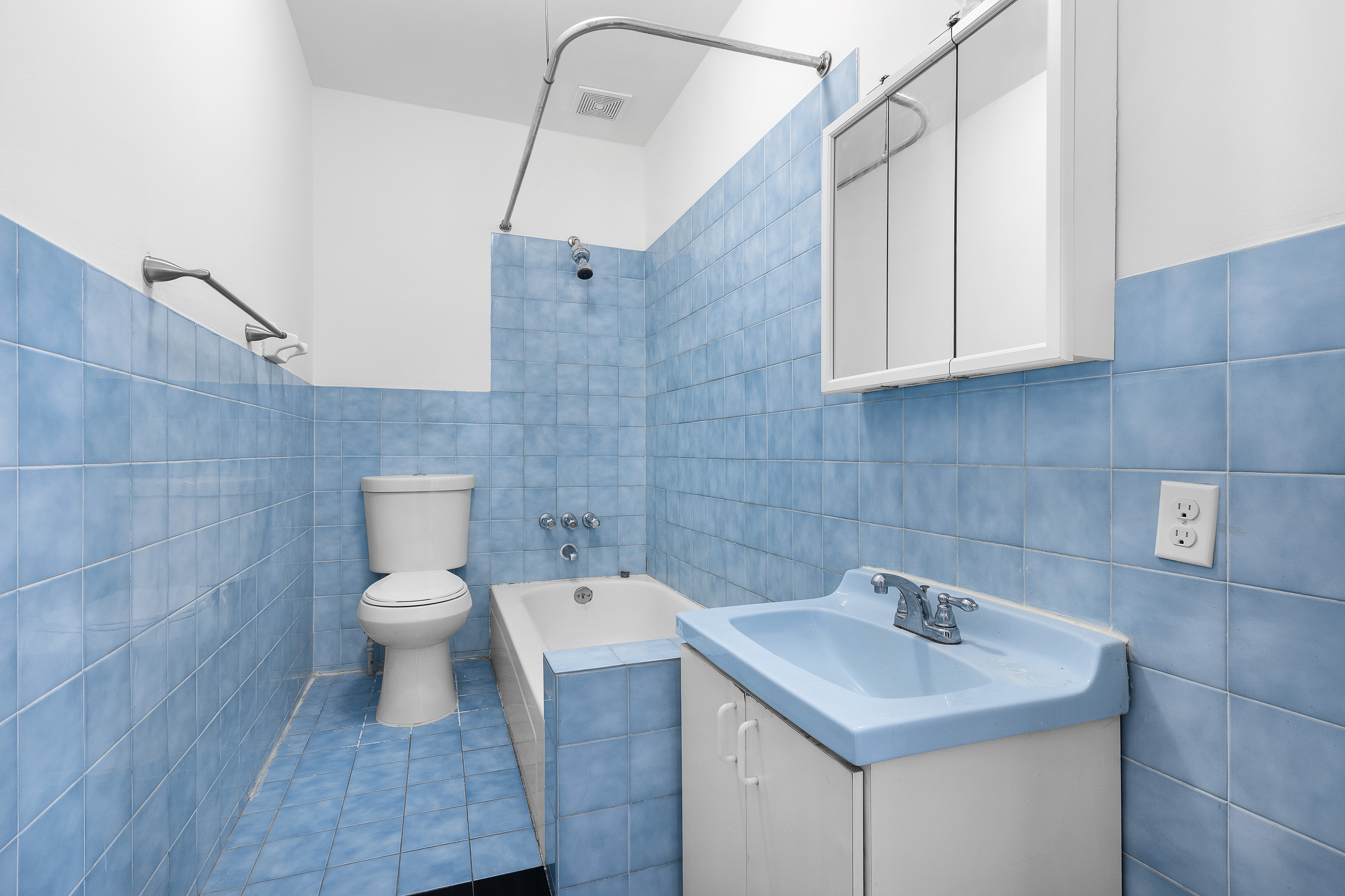 39 Broome Street Brooklyn, NY 11222 - Photo 11 of 16 a bathroom with a sink toilet and vanity