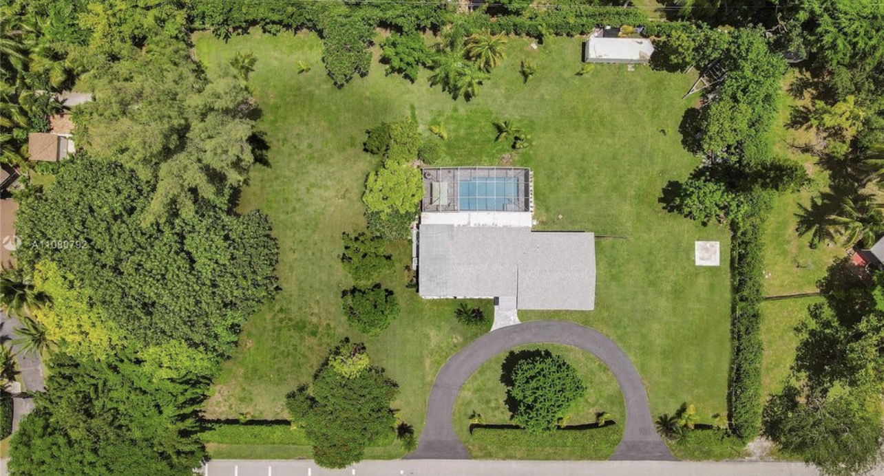 17145 Southwest 90th Avenue Miami, FL 33157 - Photo 2 of 2 an aerial view of a residential houses with yard