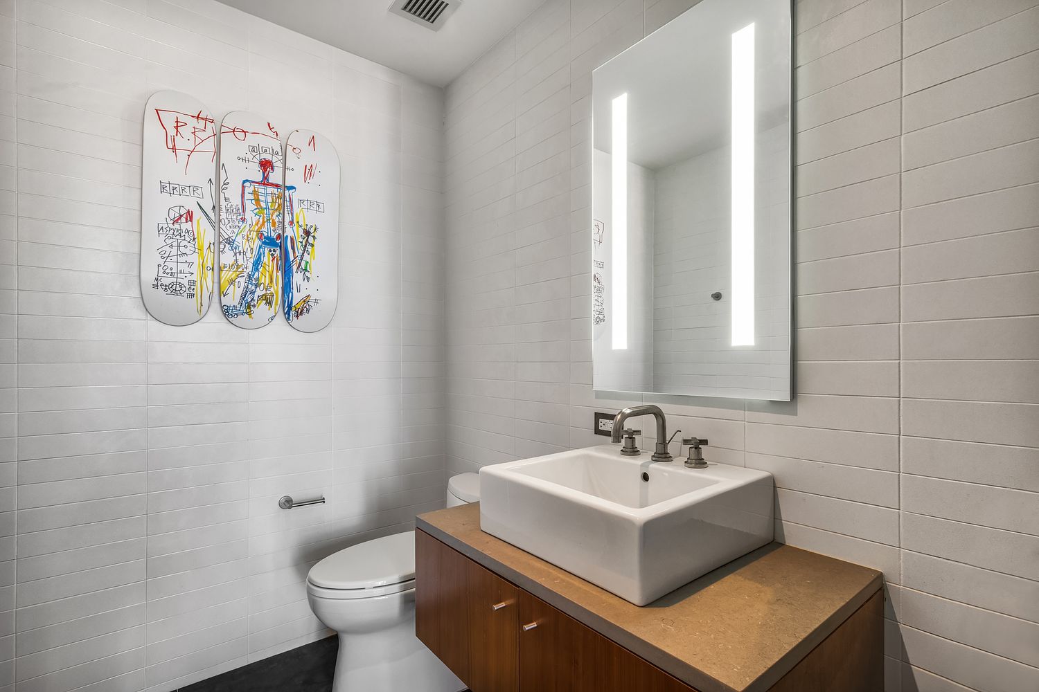 280 Metropolitan Avenue, Unit 5D Brooklyn, NY 11211 - Photo 11 of 22 a bathroom with a sink mirror and toilet