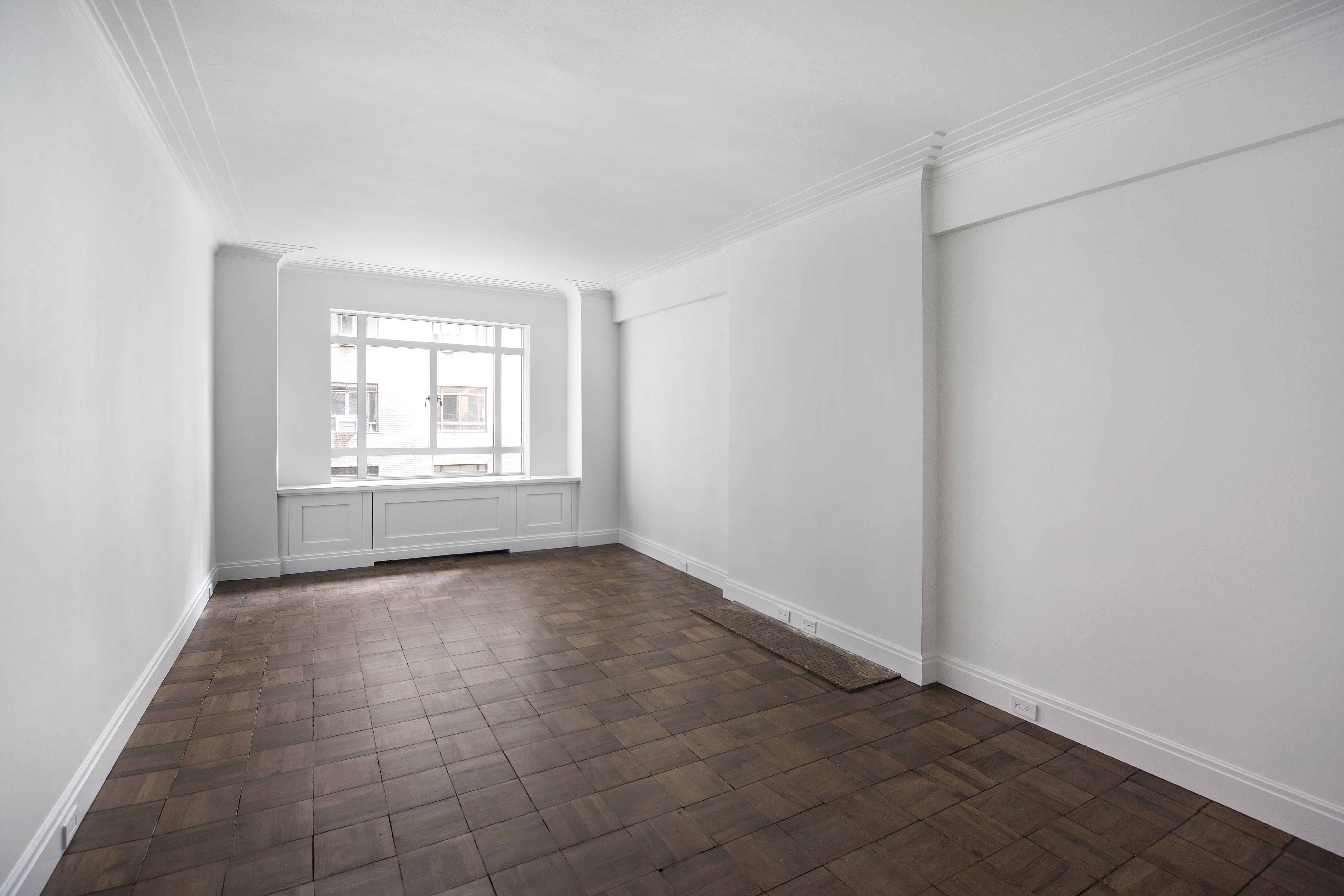 25 Central Park West, Unit 4U Manhattan, NY 10023 - Photo 2 of 8 an empty room with windows and closet