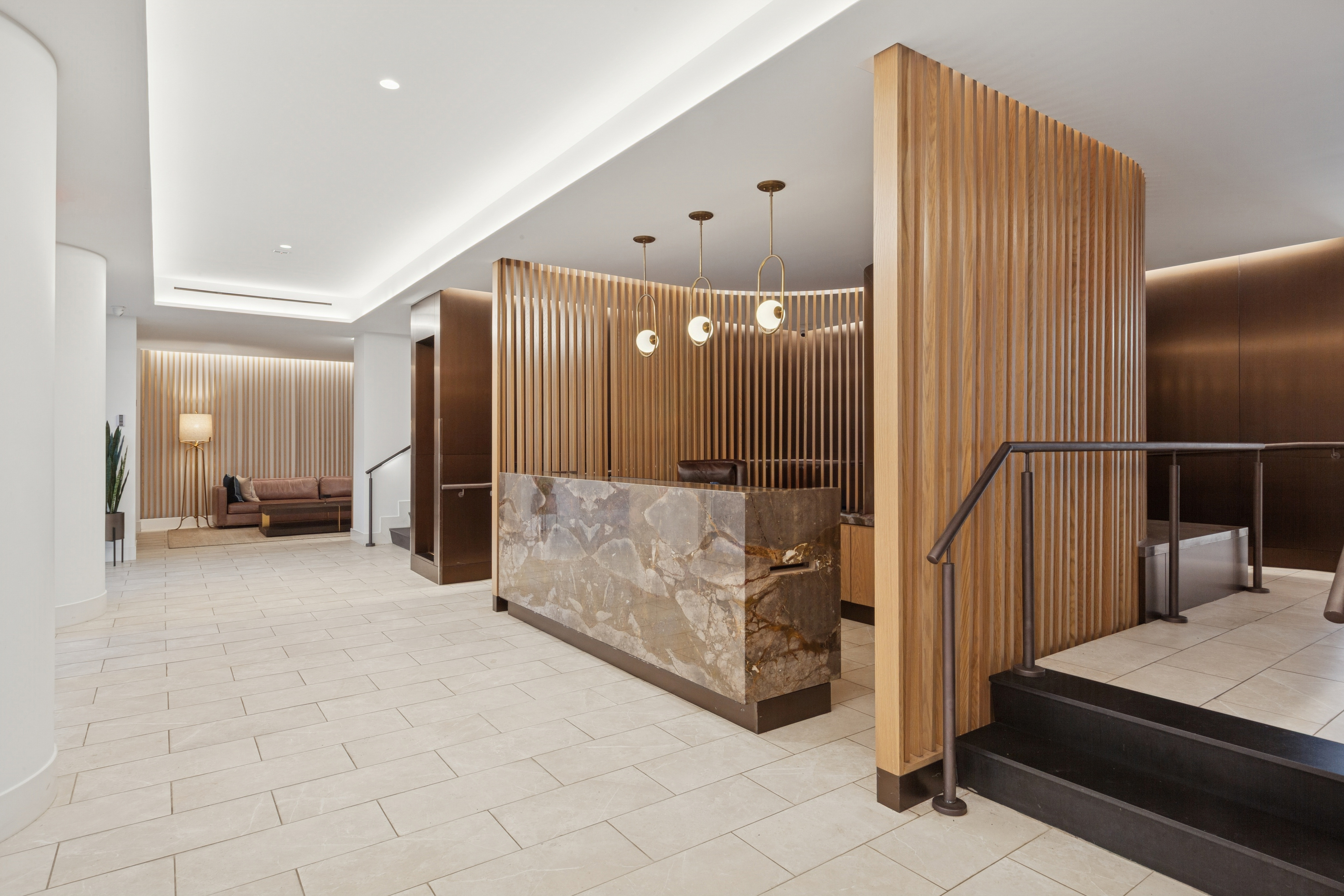 70-25 Yellowstone Boulevard, Unit 11D Queens, NY 11375 - Photo 7 of 25 a view of a hallway with entryway windows and chandelier