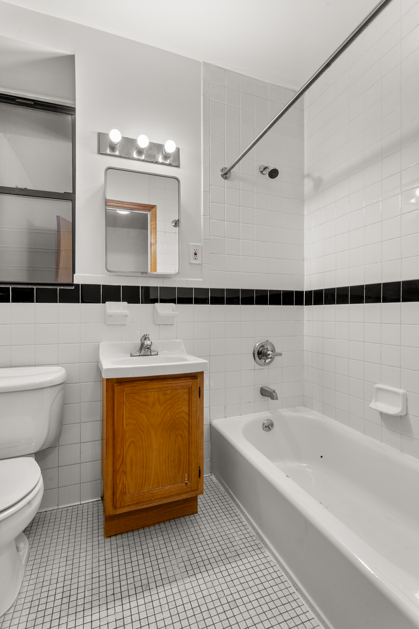 316 West 47th Street, Unit 1FE Manhattan, NY 10036 - Photo 8 of 9 a bathroom with a bathtub and a sink