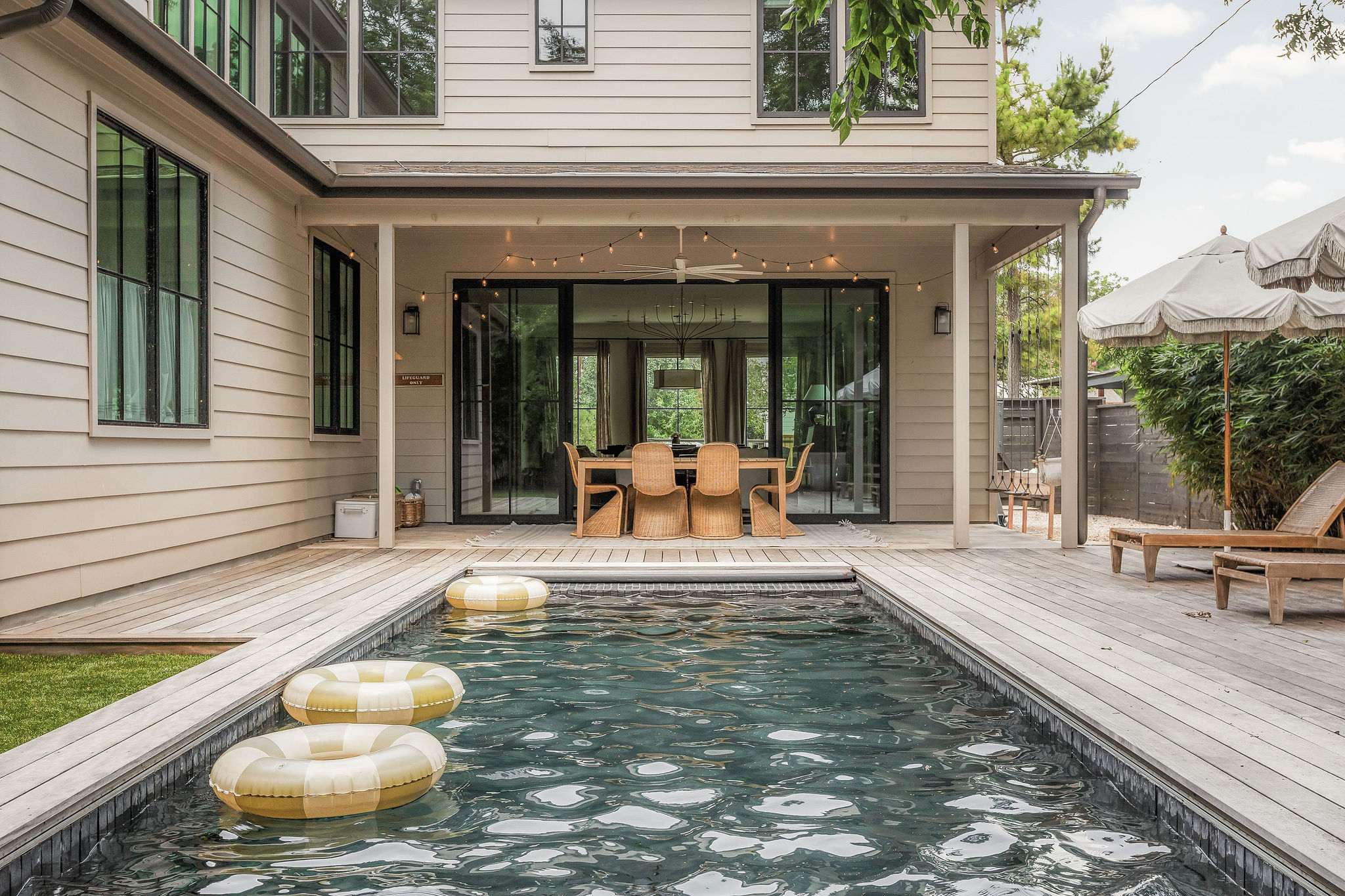4700 Clawson Road Austin, TX 78745 - Photo 26 of 26 a view of a patio with table and chairs potted plants and floor to ceiling window