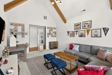 a front view of a house with a yard table and chairs