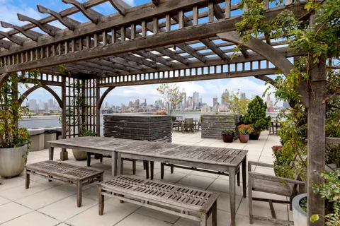 a view of a chairs and table in a patio