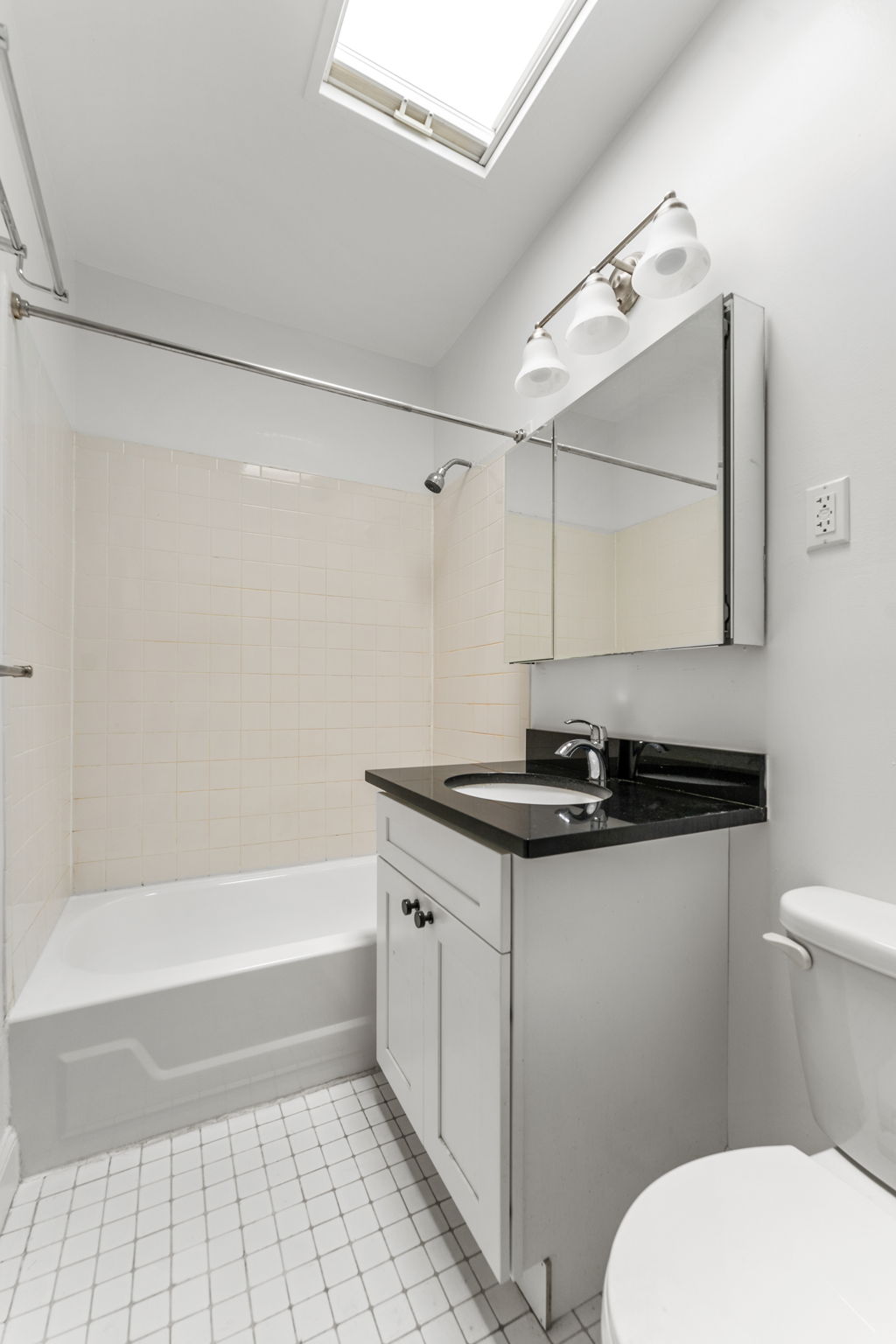 149 Sterling Place, Unit 4 Brooklyn, NY 11217 - Photo 6 of 9 a bathroom with a sink a toilet and a bathtub
