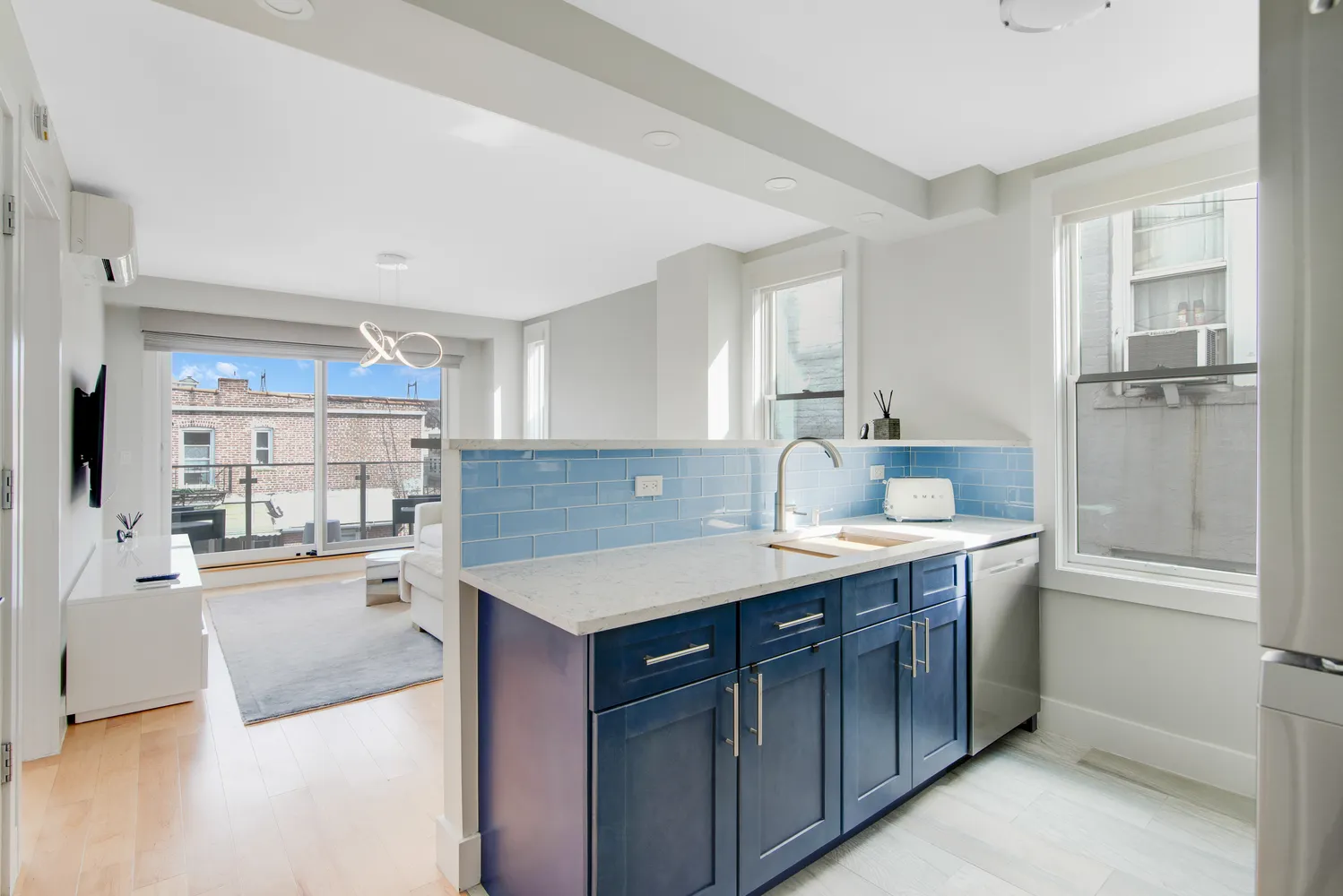 a kitchen with a sink stove and refrigerator