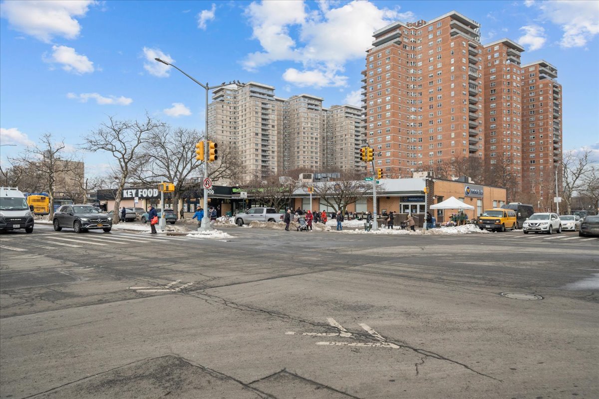 448 Neptune Avenue, Unit 16K Brooklyn, NY 11224 - Photo 18 of 28 a city street with lots of tall buildings