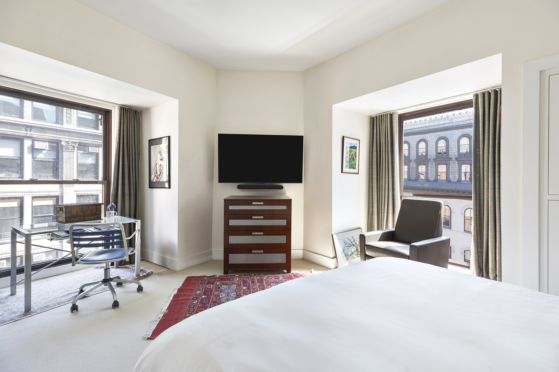 889 Broadway, Unit PHA Manhattan, NY 10003 - Photo 4 of 11 a bedroom with a bed and glass door