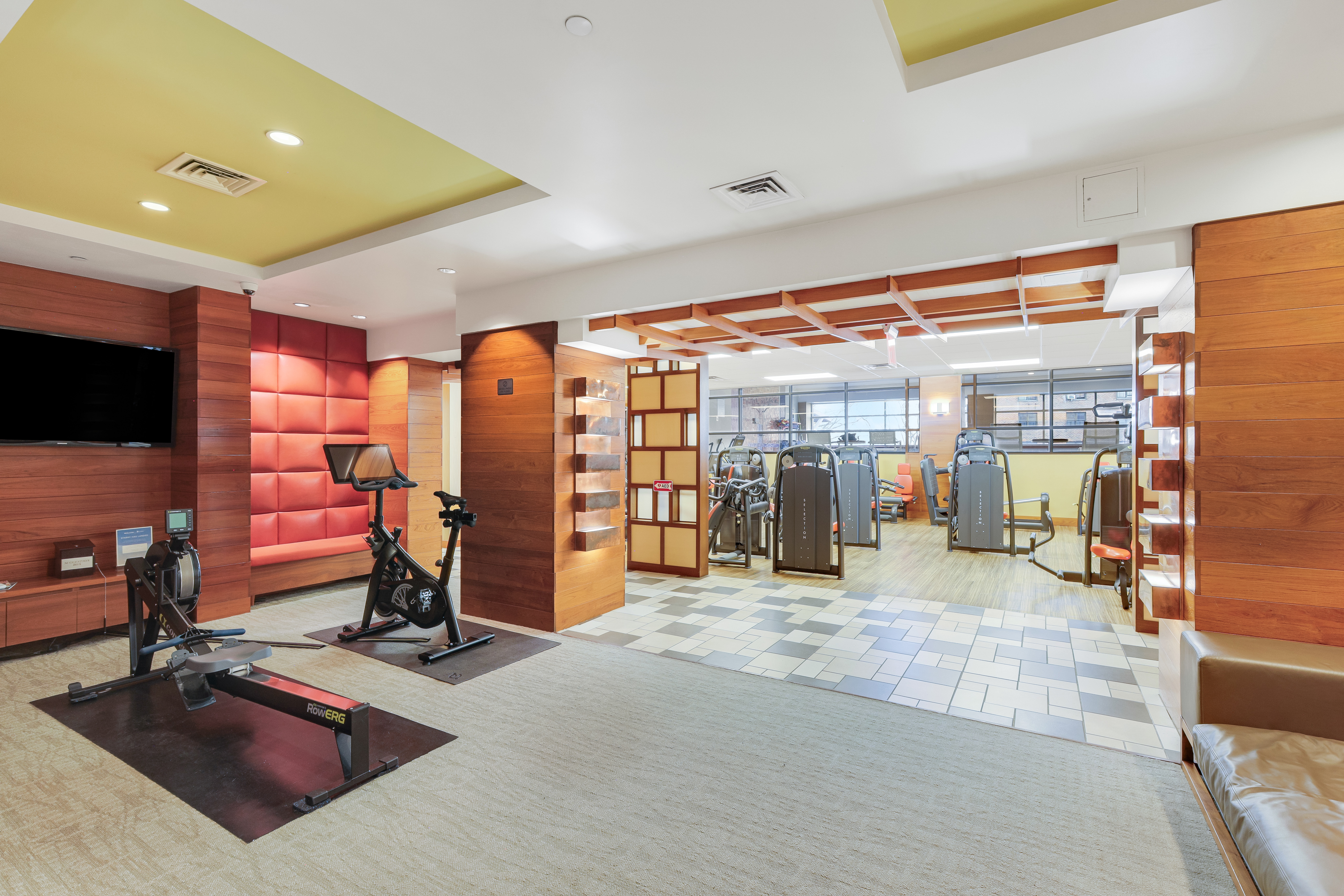 215-217 East 96th Street, Unit 25K Manhattan, NY 10128 - Photo 9 of 16 a view of a room with gym equipment