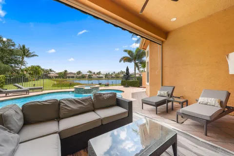 a view of swimming pool with outdoor seating and city view