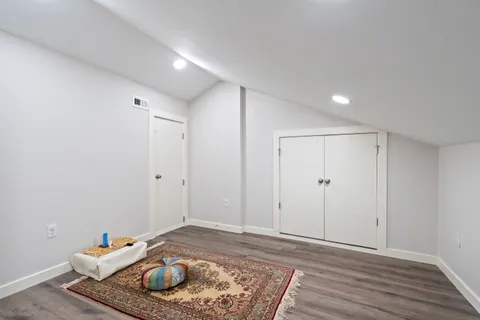 a bedroom with a bed and a table