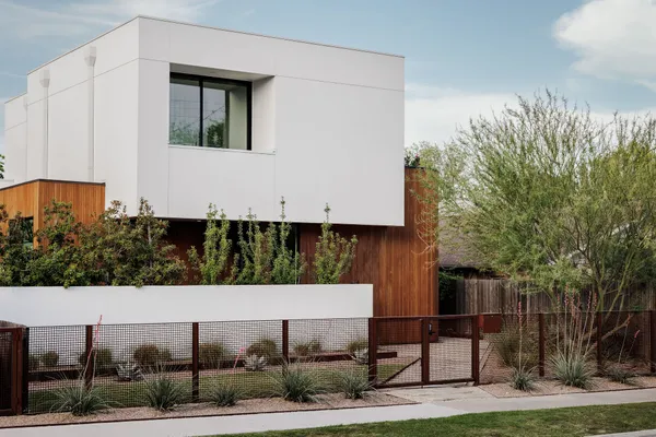 a view of house with yard and sitting area