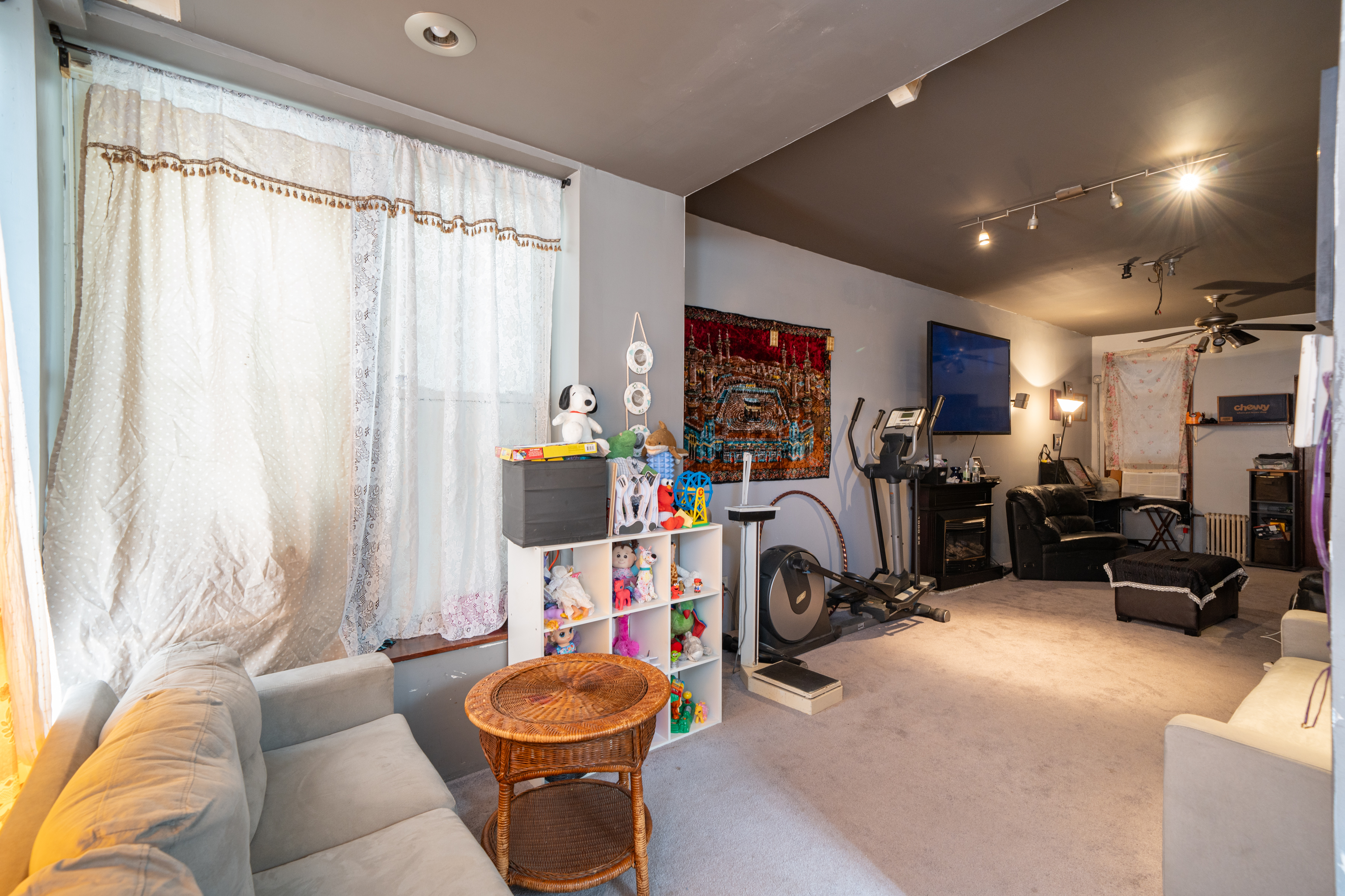 415 84th Street Brooklyn, NY 11209 - Photo 3 of 17 a view of a livingroom with furniture and a window