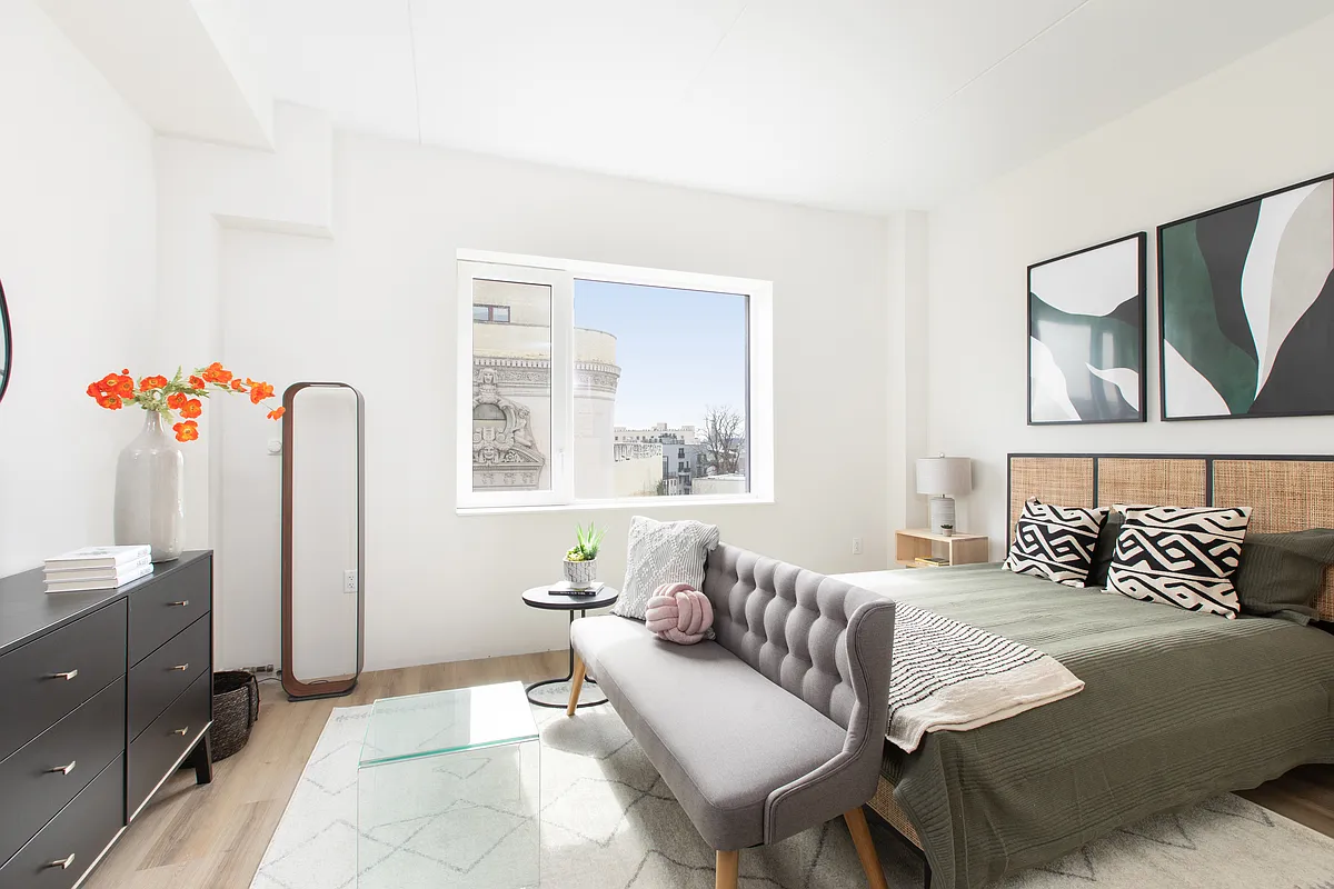 8 Palmetto Street, Unit 305 Brooklyn, NY 11221 - Photo 2 of 20 a bedroom with a bed couch and window