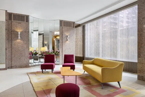 a living room with furniture and a large window