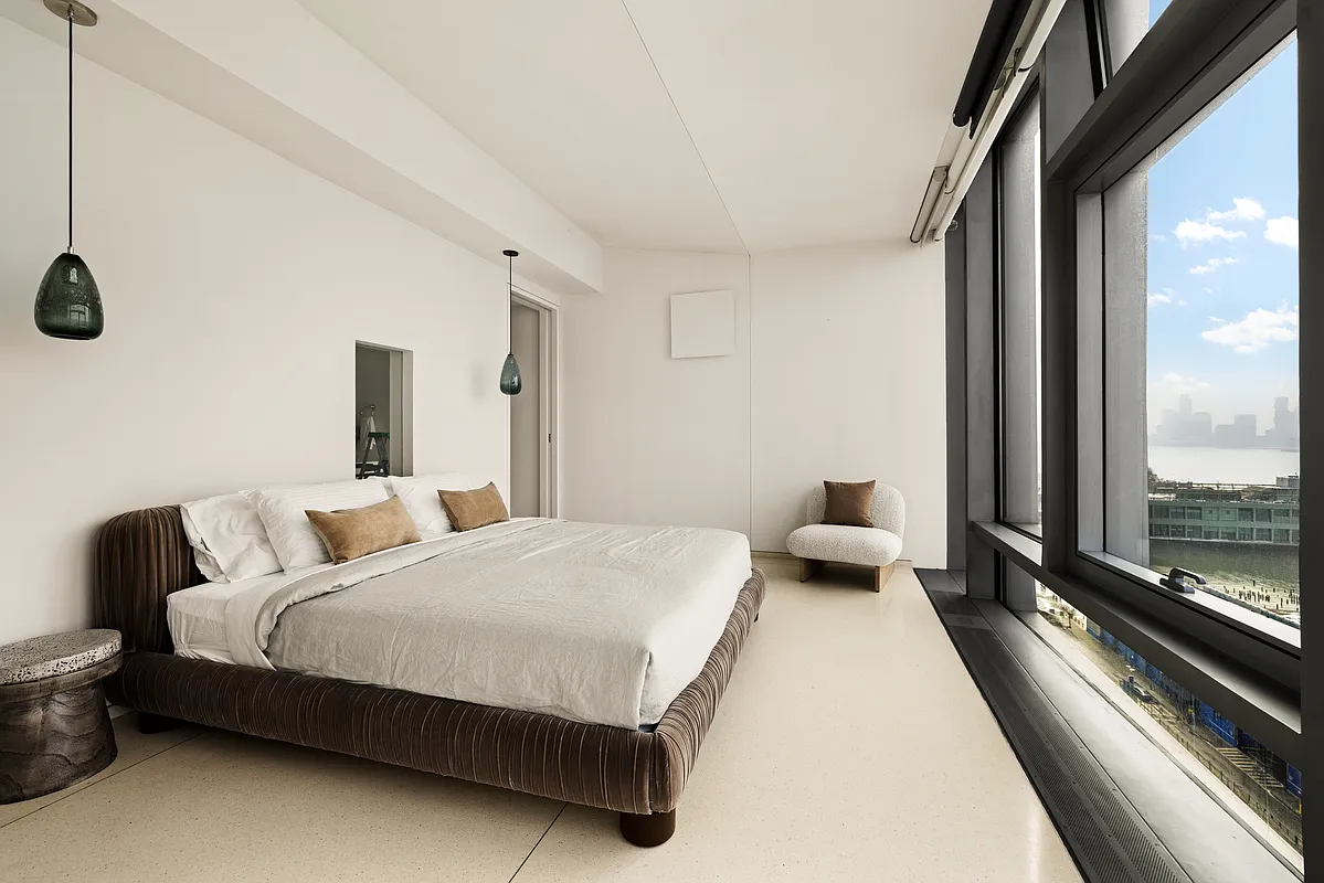 100 11th Avenue, Unit 16A Manhattan, NY 10011 - Photo 4 of 17 a bedroom with a bed and large window