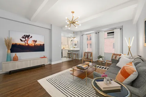 a bedroom with a bed and a potted plant