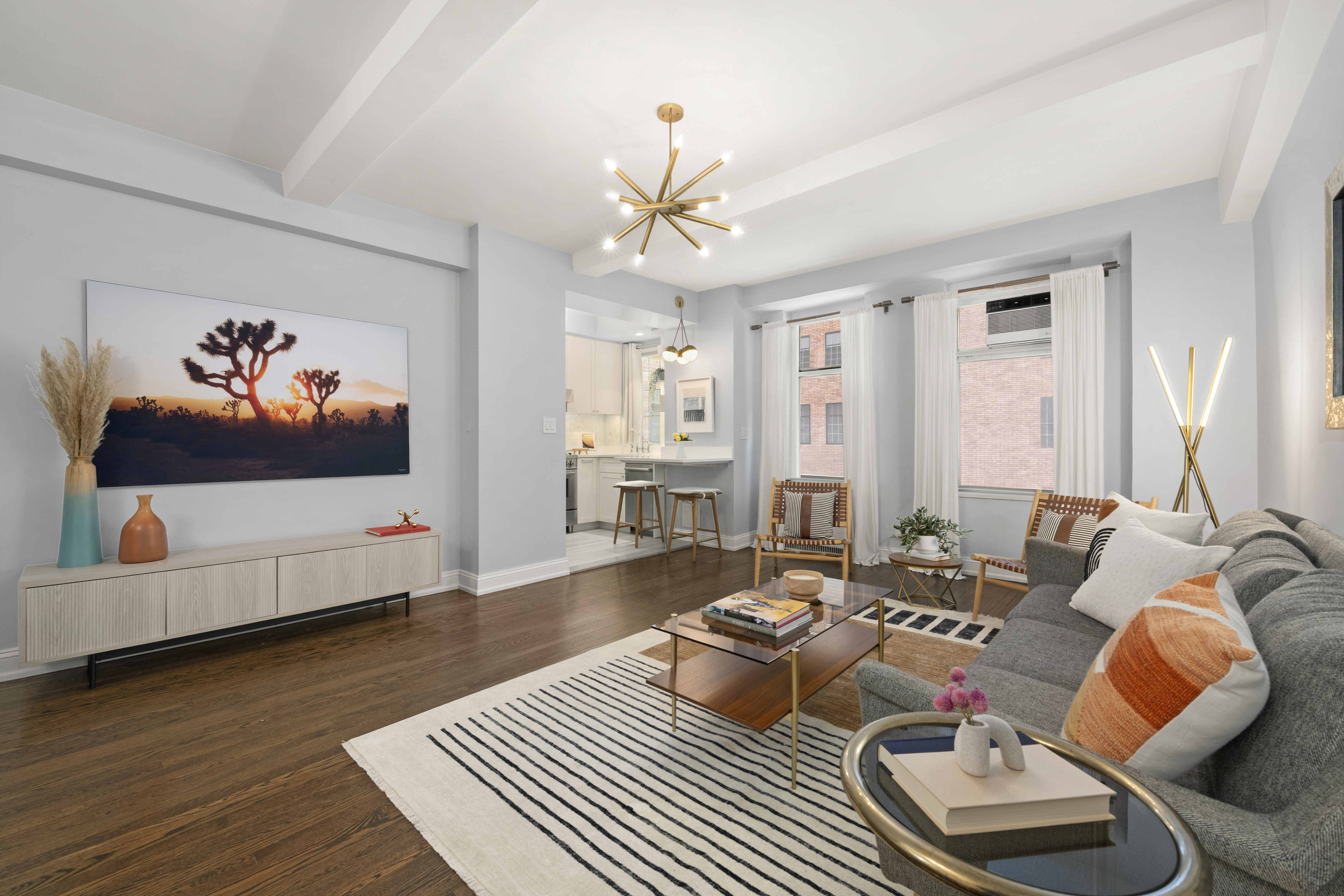 465 West 23rd Street, Unit 2G Manhattan, NY 10011 - Photo 2 of 11 a living room with furniture a rug and a chandelier
