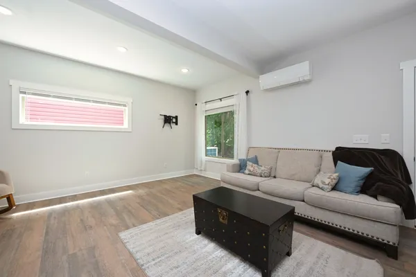 a living room with furniture and a window