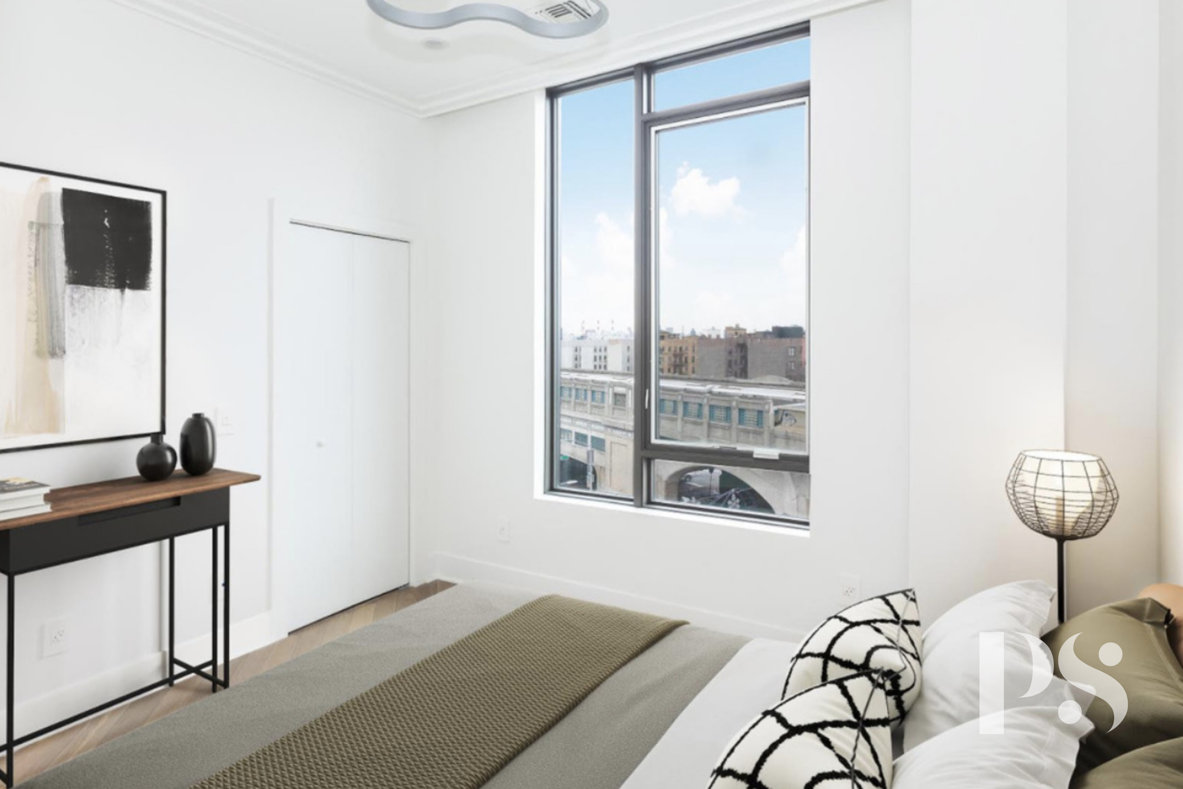 47-16 Greenpoint Avenue, Unit 4B Queens, NY 11104 - Photo 6 of 9 a bedroom with furniture and a window