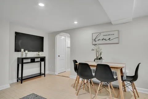 a view of a livingroom with furniture and flat screen tv